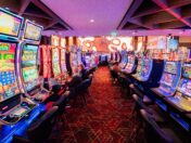 Rows of slot machines on a casino floor.