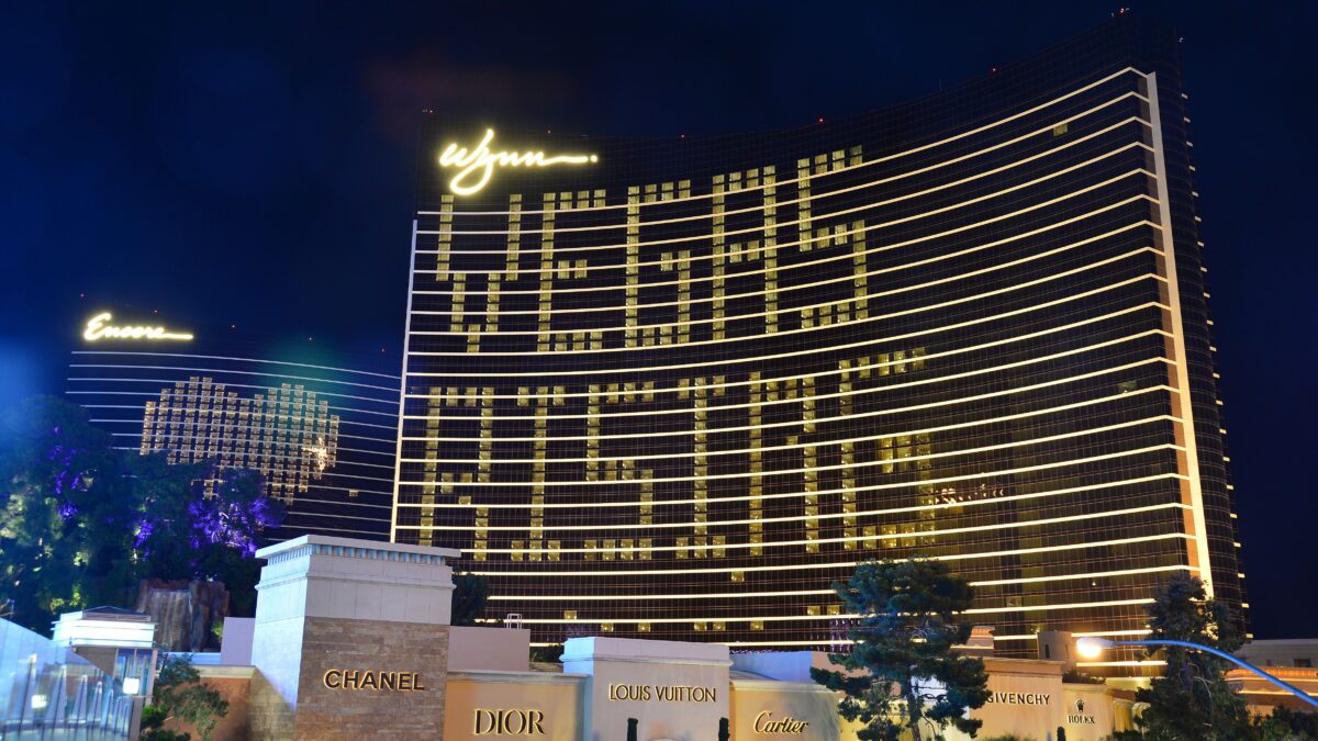 The Wynn and Encore Casinos in Las Vegas with rooms lit in the shape of a heart and the phrase "VEGAS RISING"