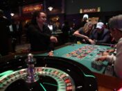 People playing roulette in a casino